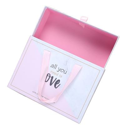 China Custom Popular Recyclable Logo UV Drawer Design Packaging Paper Box Printed Cardboard Handle Gift Box With Ribbon for sale