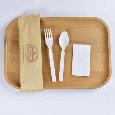 China Sustainable Biodegradable Compostable Cutlery Set CPLA Fork Spoon And Napkin In Paper Bag For Restaurant Logo for sale