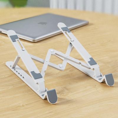 China Foldable Hard Plastic Material Portable Stylish Color Laptop PBT Notebook Stand Foldable Stand for sale