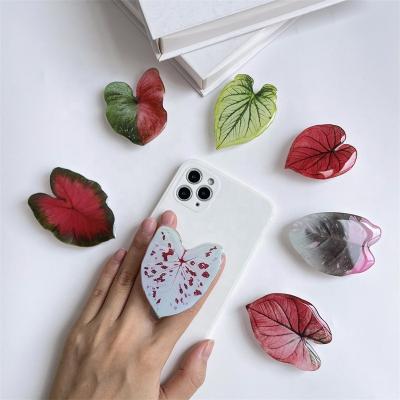 China 2022 Adjustable High Quality Acrylic Eject Mobile Phone Holder With Leaf Design Phone Socket For Mobile Phone Grip Holder for sale