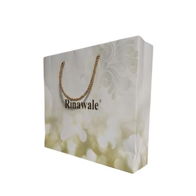 China Recycled Materials Custom Printed Matte Laminated Retail Shopping Tote Personalized White Paper Bag With Logos for sale