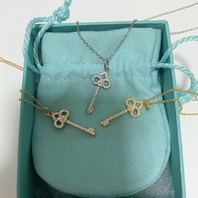 China Punk Silver Female Round T Necklace Gold Silver Female House Key Clover Necklace S925 Lucky Grass Sweater Chain With Diamond for sale