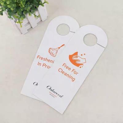 China Custom hotel service logo printing shape die cut size do not touch plastic hotel door hanger for sale