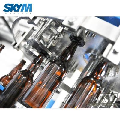 China Small Scale Automatic Juice / Soda / Beer Glass Bottle Filling Making Line Machine Te koop