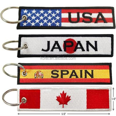 China Kofei Durable Anime Embroidery Key Flag Flag Motorcycles Cool Cars Ride On Fashion Fabric Woven Key Chain Keychain for sale