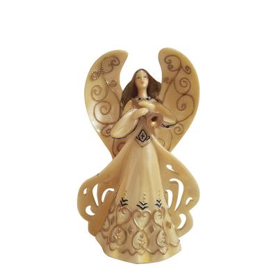 China Europe custom religious decorative angel and cross crafts resin family statue figure for sale for sale