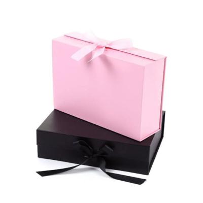 China Custom Recycled Materials Clothing Magnetic Closure Folding Paper Cardboards Luxury Gift Boxes With Black Ribbon for sale