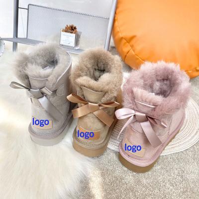 China Mini Bailey Bow Ii Fashion Boot Women's Classic Australia Fashion Trend Mid Calf Sheepskin Leather Short Fur Striping Bow Snow Boots for sale