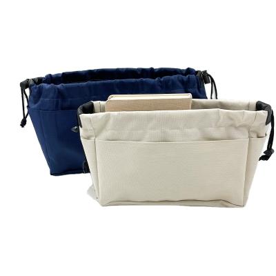 China Lady Makeup Bag Organizer Suction String Polyester Blue Wholesale Canvas Cosmetic Bag for sale