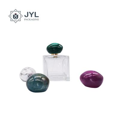 China Resin Poly RoHs Perfume Marble Cap Lid Debossing Logo Eco Friendly for sale