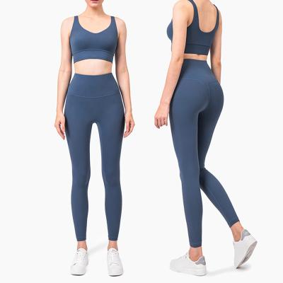 China Breathable Comfortable Naked Yoga Clothing Sports Suit Gathered Shockproof Underwear Peach Tight Pants Two Piece Set For Women for sale