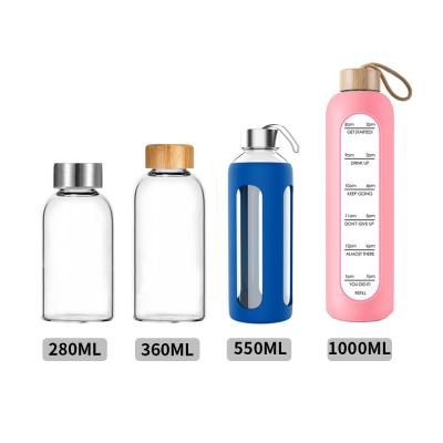 China 500ml Viable BPA Free Glass Water Bottle With Silicone Sleeve Handle Bamboo Lid Silicone Glass Water Bottle With Custom Logo for sale