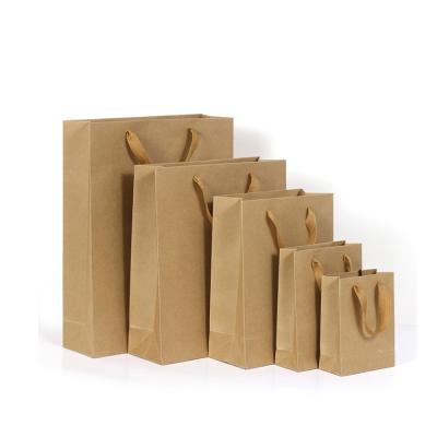 China Recycled Wholesale Luxury Shopping Recycled Luxury Shopping Custom Brown Black White Small Gift Kraft Paper Bags Custom Made for sale