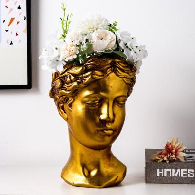 China Popular modern luxury main face cement table decoration novelty design gold Nordic flower vase for home decor for sale