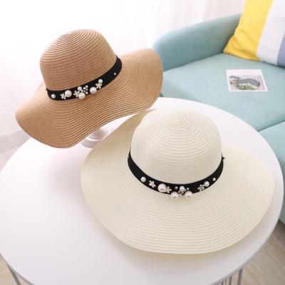 China Women Straw Hats Pearl Brim Pearl Summer Fashion Character Big Beach Sun Paper Floppy Hat for sale