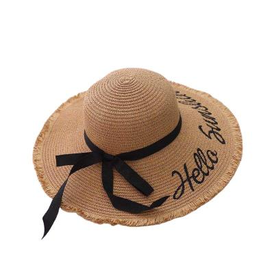 China Custom Wide Brim Floppy Disk Character Fashion Embroidery Bowknot Summer Women Paper Beach Sun Straw Hat for sale