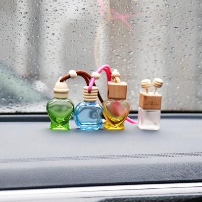 China 7ml 7.8ml 8ml 8.3ml 9.2ml 15ml Makers Cosmetic Apple Round Shape Custom Car Diffuser Hanging Perfume Bottle With Wooden Cap for sale