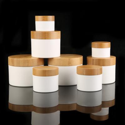 China Material Recyclable / Non Spilling 2021 Popular 10g PP White Plastic Cosmetic Packaging Cream Jars With Bamboo Lid for sale