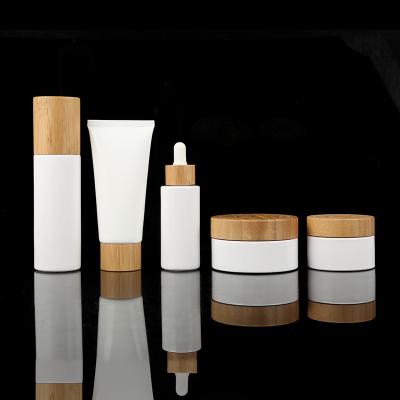 China Cosmetic Liquid / Logo Customized Empty Glass Lotion Bottles Set Essential Oil Lotion Pump Bottle White Glass Bottle for sale