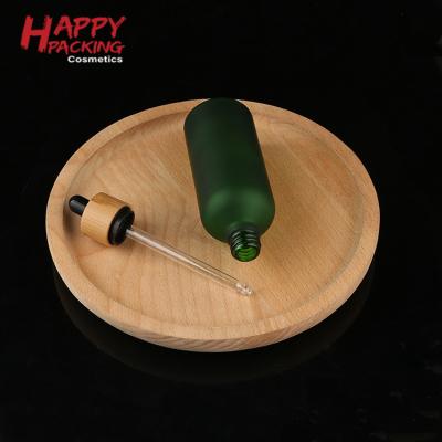 China New Style Personal Care Frosted Essential Oil Bottle Green Essential Oil Bottle Roll Bamboo Bottles for sale