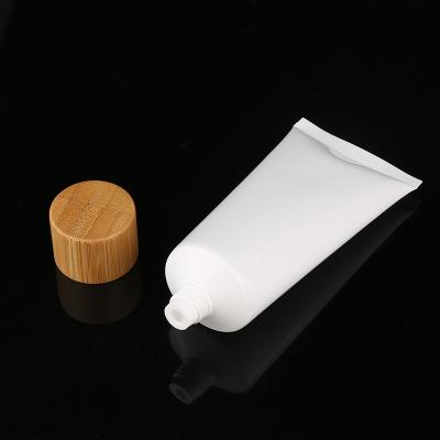 China 50ml 100ml 120ml 150ml 180ml 200ml 250ml travel lotion tube bamboo cap bamboo cosmetic lotion cream bottle PE bottle lotion tube travel lotion cap for sale