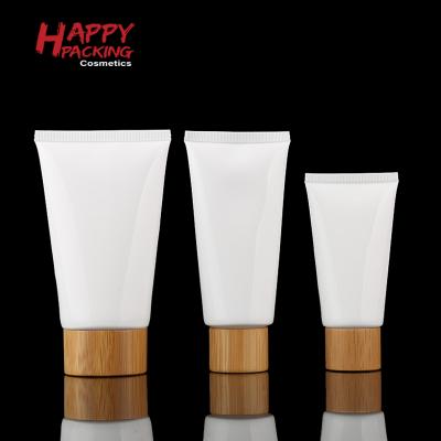 China Facial cleanser packaging 50g 100g 150g PE plastic facial cleanser cosmetic packaging tube with bamboo lids for sale