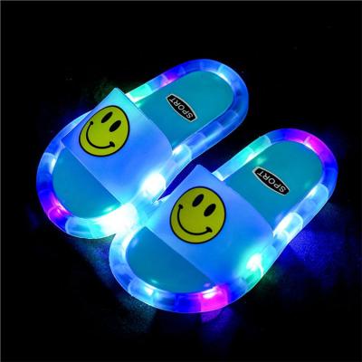 China Soft PVC Flat Flat Children's Luminous Slippers Shoes Non-slip Smile Pattern Shoes Kids Slippers For Girls for sale