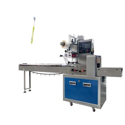 China Competitive Price Food Horizontal Bag Sachet Packing Machine Horizontal Wrapping Machinery For Toothbrush for sale