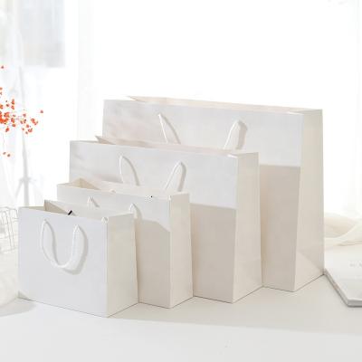 China Custom Luxury White Paper Shopping Bag Recyclable Wholesale Printing Gift Art Paper Bags for sale