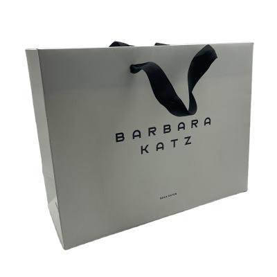 China Recyclable Custom Printed Luxury Retail Paper Shopping Bag Cardboard White Paper Bag for sale