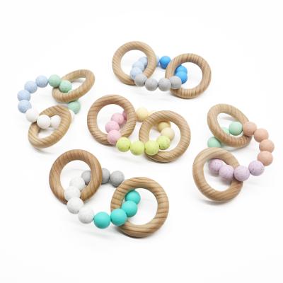 China Baby Non-Toxic Silicone Beads Wooden Toy Teether Ring Beads Bracelet Baby Rattle Teether Teether Bracelet Toys for sale