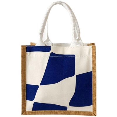 China 100% China Factory Eco-friendly Cow Spot Image Canvas Front Pockets Handles Laminated Jute Shopping Tote Bags for sale