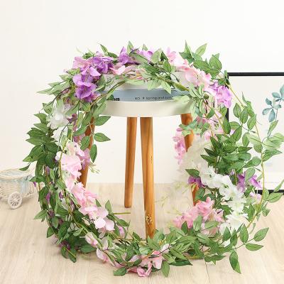 China Beautiful Colorful Artificial Flower Plant Outlet Rattan Wedding Party Arch Decoration Plant Leaf Vine Hotel Walk Ceiling 1.8M Long Wisteria Flower for sale