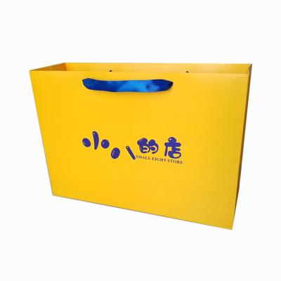 China Recyclable Custom Printing Luxury Apparel Paper Package Bags Bolsos Clothes Packaging Bags For Clothes Packaging for sale