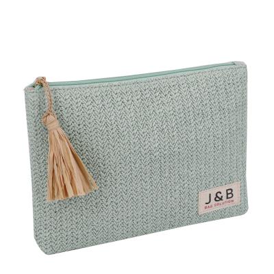 China Fashion Straw Material Raffia Tassel Handy Eco-friendly Clutch Bag Fashion Beach Cosmetic Make Up Pocket Necessaire Wash Bag For Summer for sale