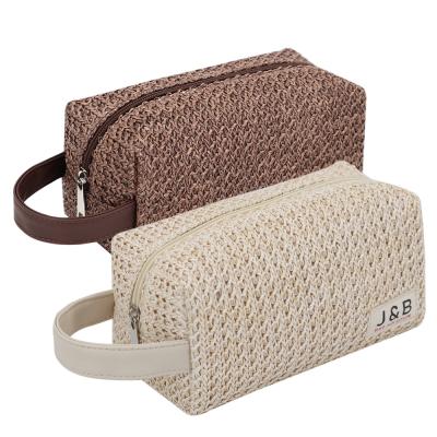 China Preppy Style PU Straw Makeup Toiletry Wash Bag OEM Factory Travel Leather Portable Cavity Knitted Clutch Pouch Cosmetic Bag For Lady for sale