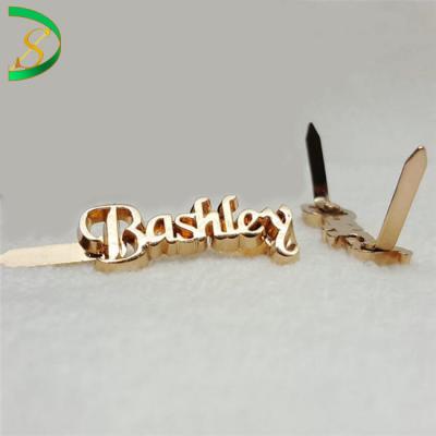 China Luxury Custom Gold Metal Logo Letters Floating Tags For Clothes Handbag Tag Nameplate Hardware for sale