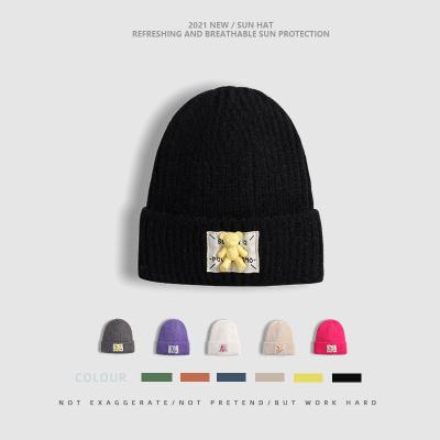 China COMMON winter knitted hats for women geometric woolen knitted hat solid de mujer gorros skullcap inviern handmade hat for sale