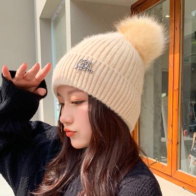 China COMMON winter knitted hats for women geometric woolen knitted hat solid de mujer gorros skullcap inviern handmade hat for sale