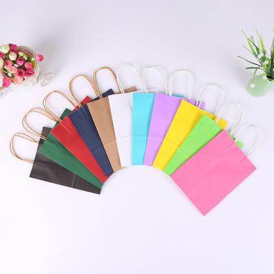 China Recyclable Customized Logo Kraft Paper Handbag Paper Packaging Bag Apparel Packaging Gift Shopping Bag for sale