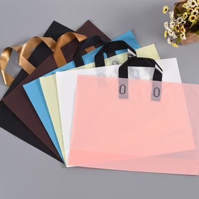 China Disposable Customized Logo Colorful Clothes Shop Reusable Plastic Shopping Bag With Handle for sale