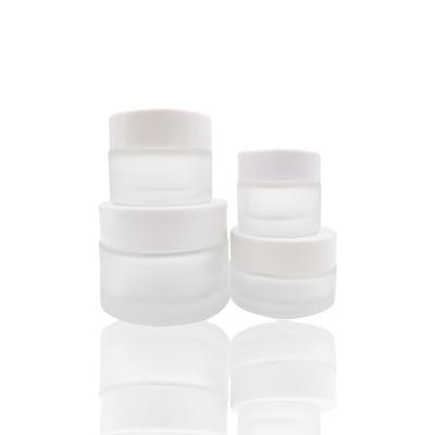 China Hot Selling Cosmetic 100g Frosted Glass Cream Jar With White Lid Eco Friendly Cosmetic Containers for sale