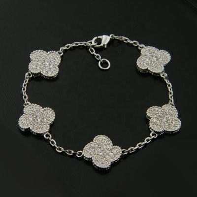 China TRENDY Customized Silver Wind Wheel Clover Flower Charms Stainless Steel Bracelet for sale