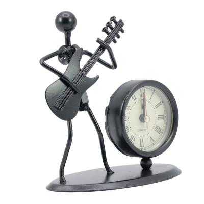 China Europe Courage New Arrival Fashion Music Metal Iron Man Clock Creative Craft For Home Decoration for sale