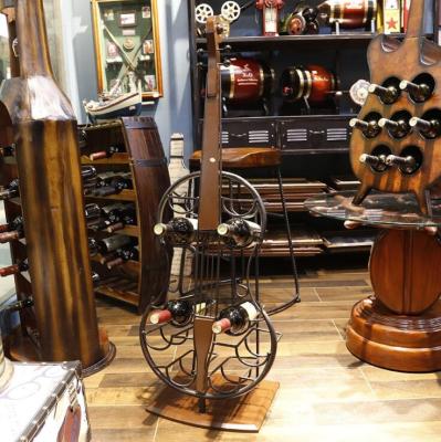 China Viable European Style 4 Bottle Cello Guitar Violin Form Iron Wine Display Rack Storage Cabinet for sale