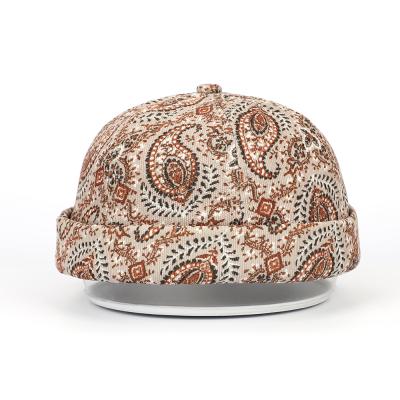 China COMMON Unique Type Retro Vintage Fashionable Adult Corduroy Design Pattern Printing Cuff Brass Buckle Visorless Rolled Brimless Cap for sale