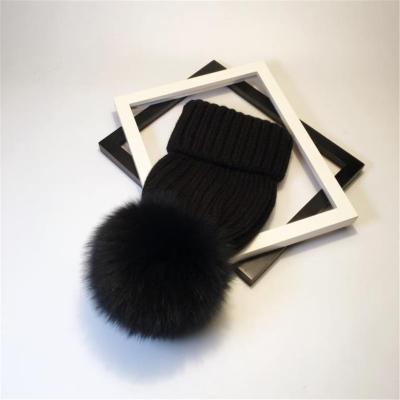 China 2020 New COMMON Fur Pom Pom Hat Fashion Black Winter Hat For Girl Women Warm Beanies for sale