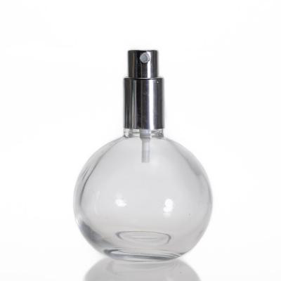 China Wholesale 100ml Personal Care Round Ball Spray 100ml Empty Clear Glass Perfume Bottle for sale