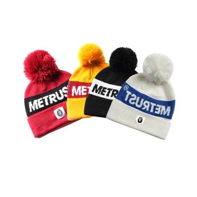 China COMMON COMMON Men'beanie Team Club Custom Letters Logo Jacquard Big Knitted Men's Pom Pom Beanies Custom Made For Cuff Wholesale for sale