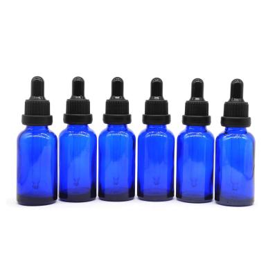 China Hot Cheap Empty Glass Bottle 30ml Cobalt Blue Dropper Bottle Essential Oil Luxury Liquor Bottles With Dropper And Black Cap for sale